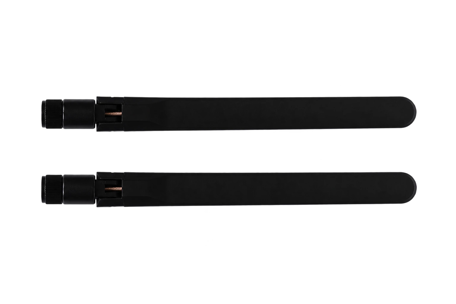 A pair of black spare transmitter antennas photographed in the studio