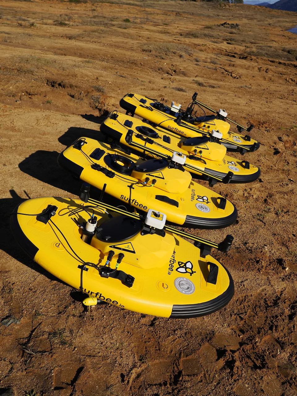 Surfbee Flow Series vessels prepared along the shore at Lake Hume